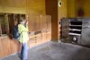 Kathleen Whitehead takes a photograph of the old baker’s oven
inside the cookhouse and mess hall building at Independence Mine
State Historical Park. As part of the park’s 30th anniversary, m