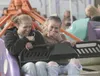 Two women react during a spinning thrill ride Friday afternoon
at the 75th Alaska State Fair. (HEATHER A. RESZ/Frontiersman)