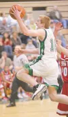 ROBERT DeBERRY/Frontiersman Colony junior John Palmer lifts the
ball to the basket during a 66-63 overtime win over East Anchorage
at Colony High School on Friday. Palmer scored 30 points in 