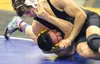 Colony's Robert Haan pins Kotzebue's Spener Woods during a 170-pound match of the semifinal round of the Lancer Smith Memorial wrestling tournament Nov. 20 at Palmer High School. JEREMIAH BAR