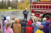 Photo courtesy Palmer fire and rescue Former Palmer fire chief
Dan Contini shares his knowledge with a group of school
children.