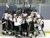 The Colony Knights celebrate Cooper Smith's game-winning overtime goal after a 4-3 win over Eagle River in the third-place game of the ASAA First National Cup Feb. 11, 2017, at the Menard Are