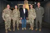 From left, U.S. Army Maj. Gen. Joseph Hilbert, commanding general, 11th Airborne Division, U.S. Air Force Gen. Dan Caine, Chairman of the Joint Chiefs of Staff; Senator Dan Sullivan of Alaska