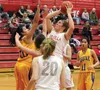 Wasilla junior Leya DePriest lifts a shot toward the basket during a win over Kodiak Friday. The Warriors finished the regular season 10-0 in Northern Lights Conference play. JEREMIAH BARTZ/F