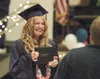 American Charter graduate Leah Thompson shows her excitement as
she walks off stage with her diploma Monday evening. (ROBERT
DeBERRY/Frontiersman)