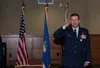 U.S. Air Force Col. Robert Davis renders a salute after receiving a Legion of Merit medal as he relinquishes command of the wing to U.S. Air Force Col. Travolis Simmons during the 3rd Wing ch