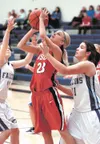 Wasilla’s Machia Toews shoots against Thunder Mountain’s Ashley
Young during the Warriors’ 71-34 win over the Falcons Thursday in
Juneau. KLAS STOLPE/Juneau Empire