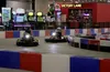 Electric cart racers negotiate a turn at the Extreme Fun Center in Wasilla on Friday, April 22. Lap times and driver skills are monitored with the same electric timing system used by NASCAR. 