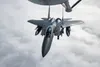 A F-15SG Strike Eagle assigned to the Republic of Singapore Air Force receives fuel from a KC-135 Stratotanker assigned to the 92nd Air Refueling Wing over the Joint Pacific Alaska Range Comp