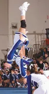 Amy Stoppa and Kamie Marmon go head over heels at the state
tournament. The Denali All-Stars took first-place overall in
gymnastics at the 2003 Alaska State Cheerleading Competition. Photo
co
