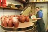 Mudslinger Pottery's Stephanie Peterson finds winter warmth with
three kilns cooking around the clock to fill her orders from
statewide gift shops. Peterson said of the heat in her studio, "Y