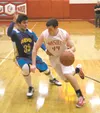 Wasilla freshman Koby Burns drives toward the baseline during the first half of a 65-60 win over Kodiak Saturday afternoon at Wasilla High School. JEREMIAH BARTZ/Frontiersman