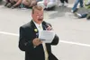 ROBERT DeBERRY/Frontiersman John Klapperich announces floats as
they approach the judging station at the 2009 Wasilla Fourth of
July parade.
