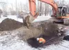 Workers with Dirtworks Inc. work on finding the busted water
main near the intersection of W. Beaver and N. Alaska streets that
began leaking water early Sunday morning. (ROBERT
DeBERRY/Front