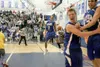 Palmer Moose Senior Justin Draughon, center, celebrates after
nailing a bucket to win a berth at the state tournament in
Anchorage later this month. (ROBERT DeBERRY/Frontiersman)