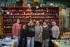 The team at the Art Cafe standing in front of organized mosaic tiles. Pictured from left to right: Kyla Peria, Kim Reid, Judy Vars, Becky Holsinger, Sonya Meagher and Linda Hessmer. Not pictu