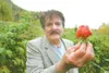 Steve Garcia holds one of the large strawberries he grew on his property off the Old Glenn Highway near Butte in this Frontiersman file photo taken in 2008. Garcia was killed in 2014 by Mike 