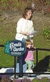Tracy Ressler, with the help of 22-month-old Madison Ressler,
dedicates Cyndi's Garden, in honor of long-time Frontiersman
employee Cyndi Sandoval, who lost her battle with cancer in 2001.
Th