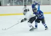 Courtesy photo Former Palmer High School player Tyson Alger, in
white, has found new life on the ice on the University of Montana’s
ACHA team.