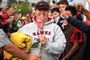 Longtime Houston High volunteer athletic trainer Carolyn Black is handed roses as she is honored for her 21 years of service during halftime of Houston's C-team footbal game against Wasilla T