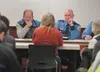 State House District 10 Rep. Mark Neuman and Col. James Cockrell, acting director for Alaska State Troopers, listen to Loi Ricker during a public safety town hall meeting Friday evening at th