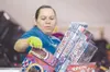 Special Santa volunteer Teresa Martinez organizes games Thursday
afternoon in the Special Santa warehouse in Wasilla. (ROBERT
DeBERRY/Frontiersman)