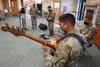 Army Sgt. Johndavid Untalan, a native of Dededo, Guam, and a bassist assigned to the 9th Army Band, 17th Combat Sustainment Support Battalion, U.S. Army Alaska, rehearses with fellow Soldiers