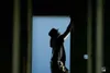 ROBERT DeBERRY/Frontiersman Dave Sims, a worker with Western
Enterprises, installs a door frame at the new City Center Commerce
Park off South Knik Goose Bay Road. The 12-acre parcel will
eve