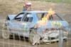 MATT TUNSETH/Frontiersman Mike Kriger hustles around the front
of his 1999 Chevy Lumina after the car caught on fire following a
demolition derby Sunday at Capitol Speedway in Willow. Kriger 
