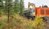 Brad Mothershead, Butte, from Statewide Clearing, Inc of Eagle River climbs onto his excavator with a mulching head to begin clearing the utility easement for the new MyHouse Carson-Cottle Ce