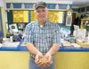 Budget Feed owner Mike Presley holds a handful of his Alaska
Grown Dog Food. Presley said the Alaska Grown dog food is one of
his top sellers today. He still makes it the same way, with Kodia