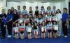 Gymnasts and coaches pose for pictures following Saturday's meet
at Denali Gymnastics in Wasilla. Gymnats were awarded ribbons for
their performance in each event as well as their overall sco