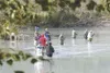 ROBERT DeBERRY/Frontiersman file photo Fishermen and women
gather along the bank of the Knik River at Eklutna Tailrace hoping
to snag a king salmon last year.