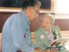 GREG JOHNSON/Frontiersman Mary Harvey reminisces with Erling
Nelson at a 2008 reception in her honor at the Old Wasilla town
site near the Dorothy Page Museum.