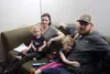 Sarah and Blake Stuker, and their daughters India and Eilie, in their Wasilla home. The Stuker family is leaving Alaska to be closer to specialists who can help them care for India, who has a