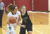 Kenai Central forward Alexis Baker works to beat Colony guard Amanda Smith (10) Friday at Kenai Central High School. Photo by Joey Klecka/Peninsula Clarion