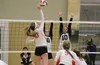 Colony seniors Mackenzie Everett and Sophie Hall reach to block a hit by West Valley's Nora Troppmann during Colony's 3-2 win over the Wolfpack in the first round of the ASAA/First National B