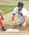 Mat-Su Miner shortstop Josh Mader dives back into first base
during the first inning of their loss against AIA on Wednesday.
Mader led the Miners with the bat, going 3 for 4 with three RBIs.
