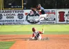 Kenai second baseman Jacob Sonnen leaps to grab a high throw as Wasilla's Koby Burns slides underneath into second safely durnig Kenai's win over Wasilla Thursday, July 28, 2016, the third da
