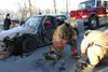Members of the Mat-Su Fire Department prepare the Jaws of Life
to use on the Honda in order to pull out the victim. Photo by BOB
MARTINSON/Frontiersman