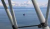 A vessel approaches Hilcorp’s Tyonek offshore platform in Cook Inlet, where the company was using the Spartan 151 drilling rig last summer.  Nathaniel Herz/Northern Journal)