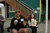 Brodie Alcantra, 16, and Teshya Alcantra, 13, proudly display their vaccination cards and free meals from the concession stand at the Mat-Su Miners game on Tuesday Tim Rockey / Frontiersman