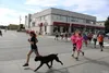 Happy Run participants embark from AKtive Soles Performance Footwear and make their way through downtown Palmer. File photo
