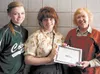 Colony High School students Brittany McCaulley and Grace Kari pose with recently retired assistant professor of art Suzanne Bach with certificates of achievement from the Mat-Su College Art D