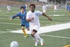 Palmer senior James Nisbett beats a Bartlett player down the sideline during a 1-0 win over the Golden Bears Thursday at Palmer High School. Jeremiah Bartz