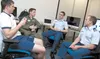 Cadets on the Air Force Academy’s cyber competition team discuss buffer overflow exploits during a team meeting in the academy’s Cyberwarfare Lab Oct. 3, 2011. The team won a ‘capture the fla