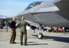 U.S. Air Force Col. David Berkland, 354th Fighter Wing commander, talks about the F-35A Lightning II fifth-generation fighter aircraft to retired U.S. Air Force Lt. Gen. Bruce “Orville” Wrigh