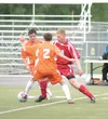 Wasilla senior Vladimir Dahl moves the ball between a pair of
West Eagles during the first half of the Warriors’ 2-1 loss to West
on Saturday at AFS. JEREMIAH BARTZ/Frontiersman