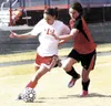 Wasilla junior Nikki Vanni brings the ball up the right side of
the field during the Warriors’ 3-1 win over Kenai on Saturday.
Vanni scored Wasilla’s third goal in the win. JEREMIAH
BARTZ/Fro