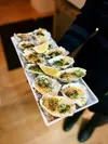 Fresh Kachemak Bay oysters, prepared either raw or baked, are a popular appetizer at Feather and Flour. The Palmer restaurant is offering diners a 10 percent discount on oysters if pre-ordere